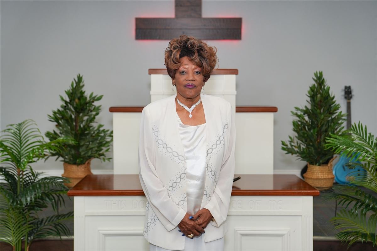 A church member in white at the altar of Deliverance Baptist Church in Marianna, Florida