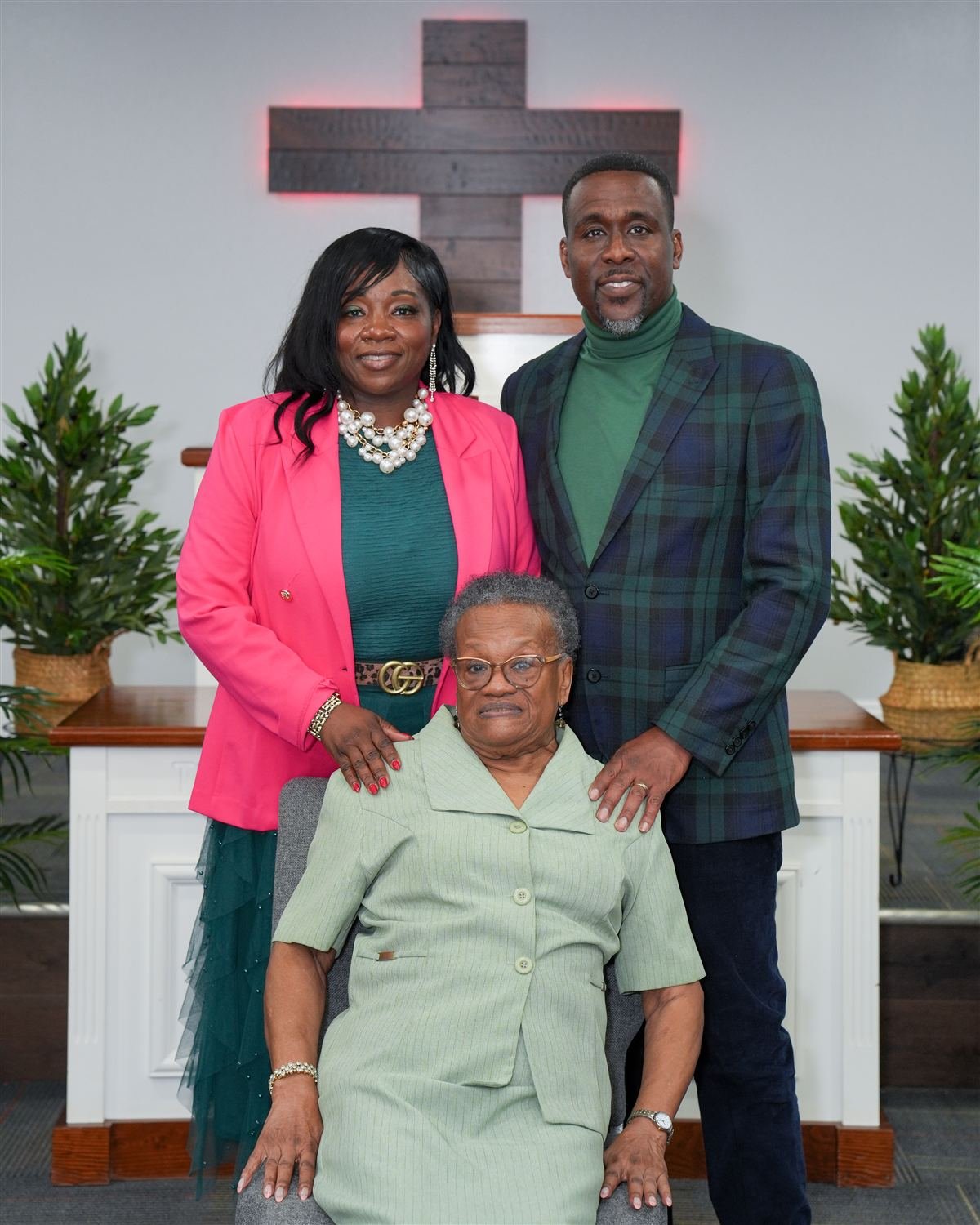 Pastor Dennis Libert and Lady Latonya Libert with a church elder at the altar of Deliverance Baptist Church, Marianna FL